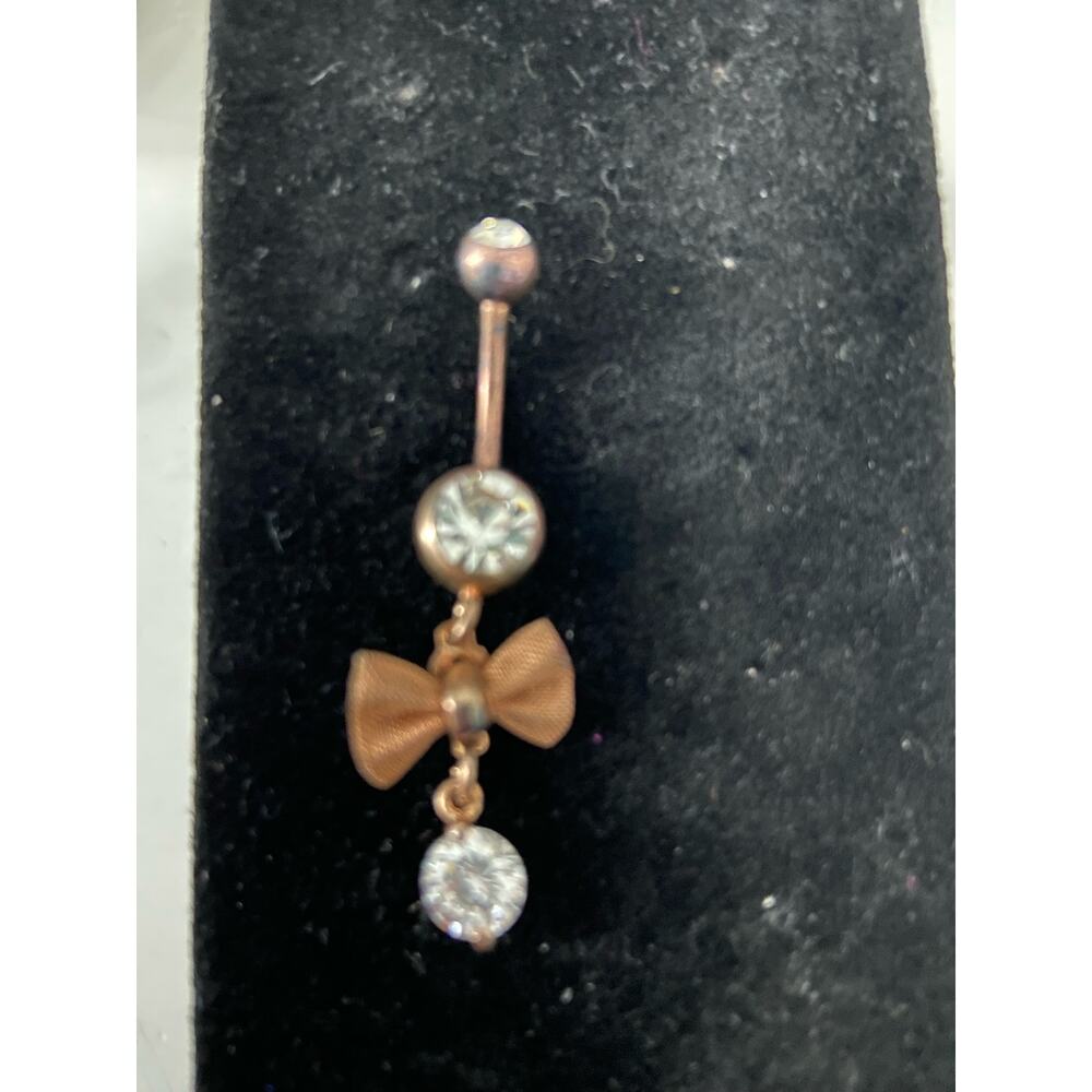 Belly button ring with bow copper tone